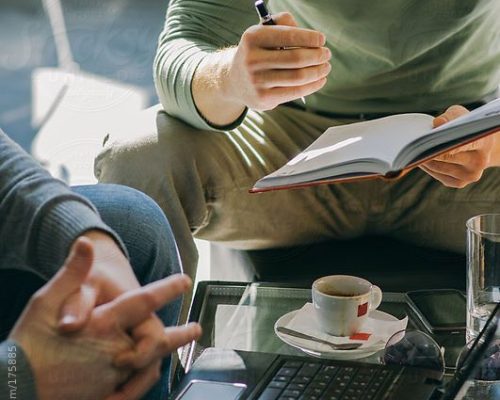 Close Up Of Anonymous People In A Business Meeting by Stocksy Contributor Aleksandra Jankovic