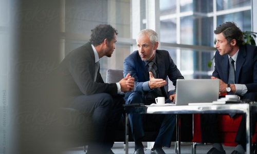 Group of corporate business people having a meeting by Ondine Stocksy United