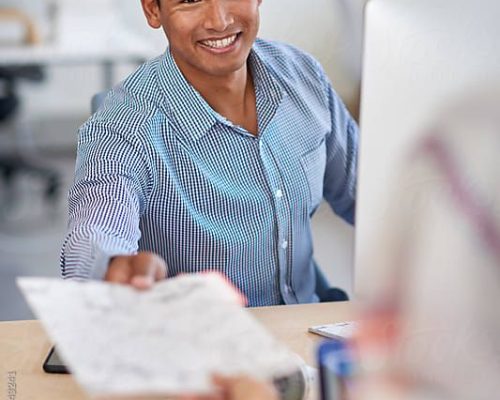 Office Teamwork Man Working With Coworker by Stocksy Contributor Daxiao Productions