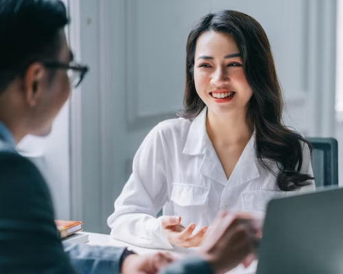 Premium Photo Two asian businesspeople working at office