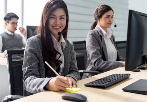 Premium Photo _ Smiling call center working