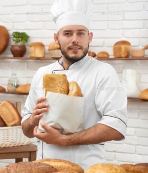 Young man working at his bakery